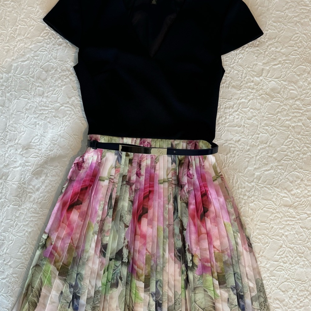 Chic Black Top with Floral Pleated Skirt
